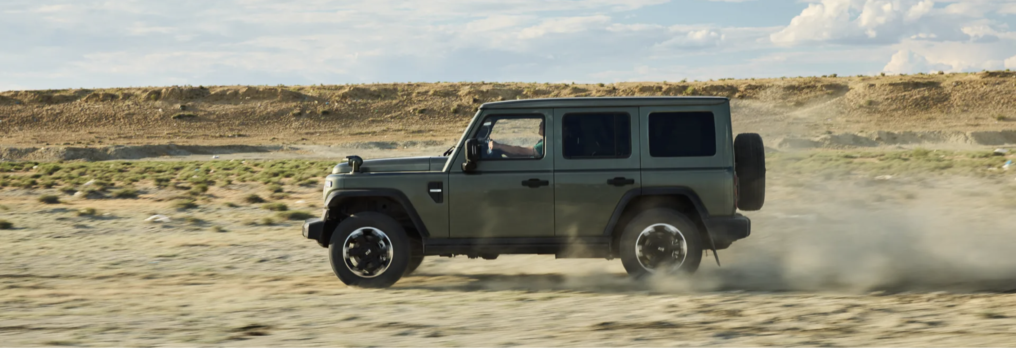 212 driving across an open landscape